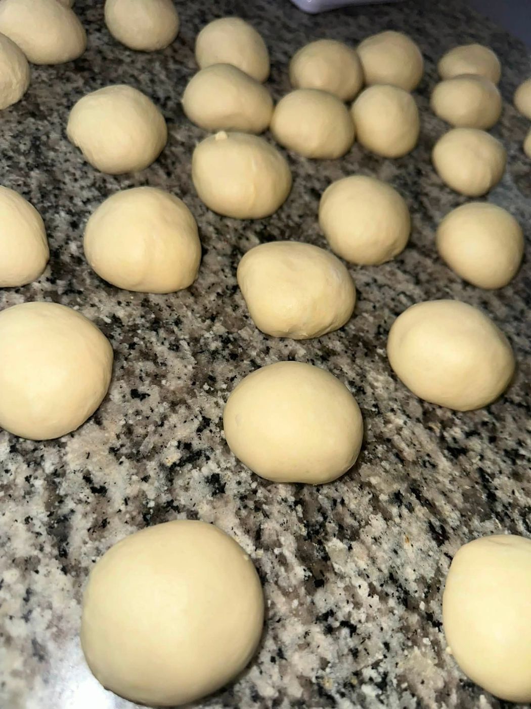 Portioned dough balls resting on the counter