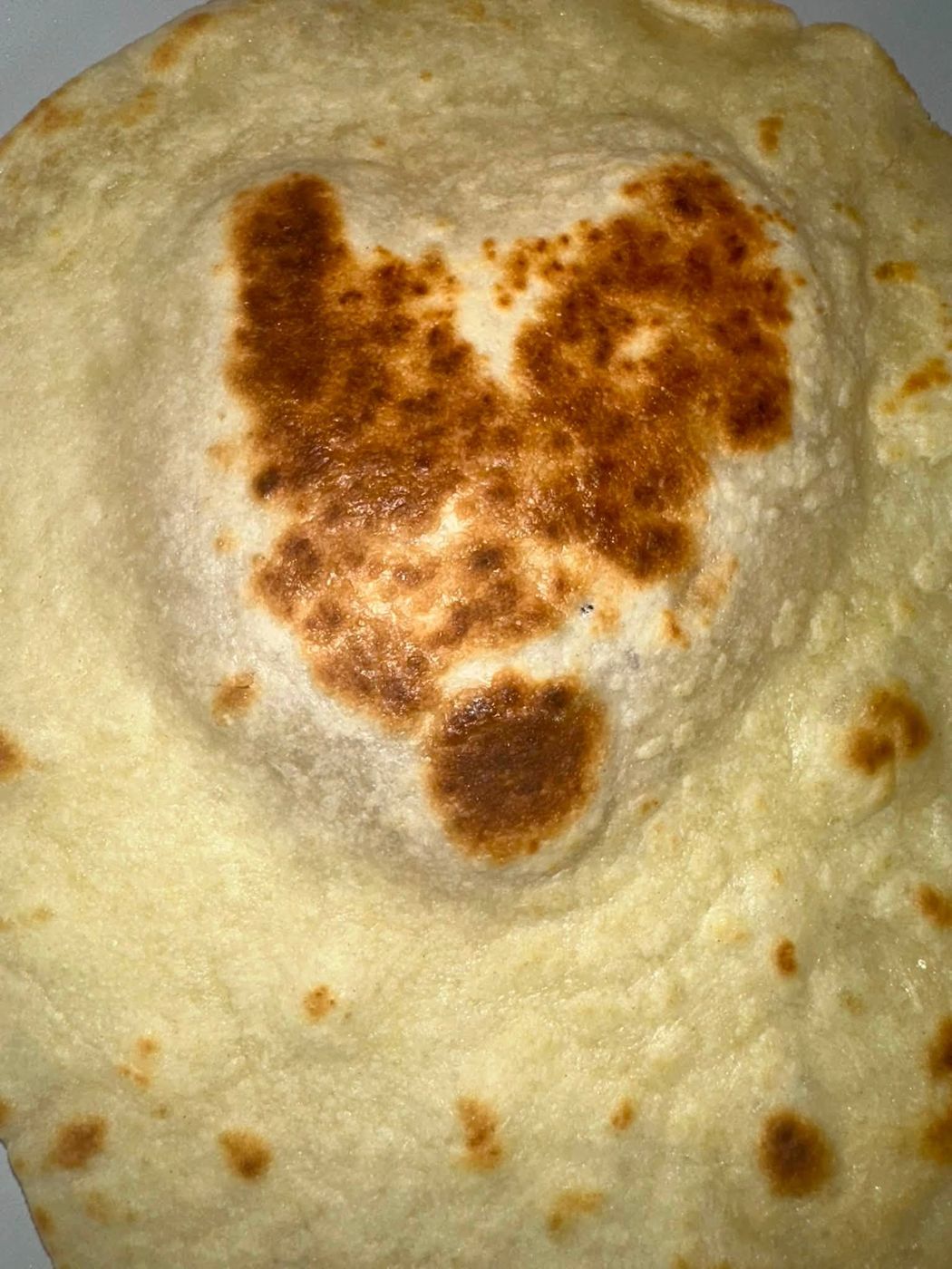 Flatbread with a heart-shaped toasted spot